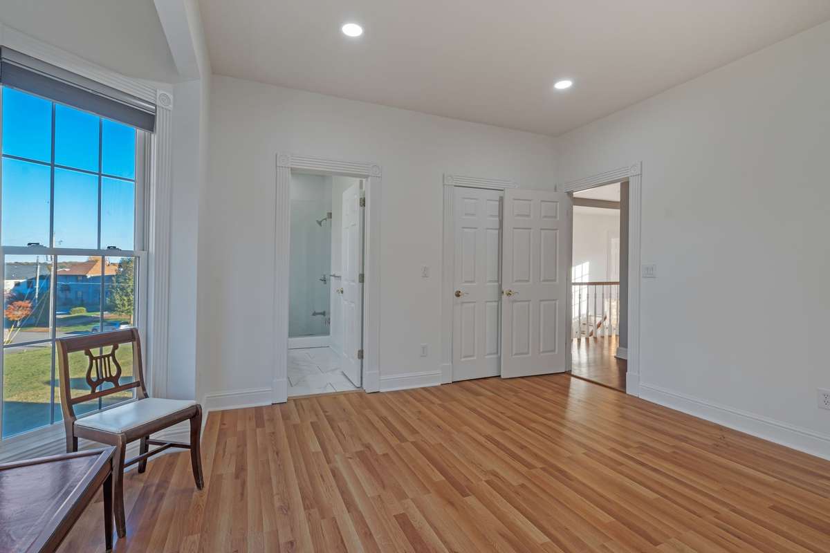 The door behind the entrance to the bedroom is a walk-in closet.