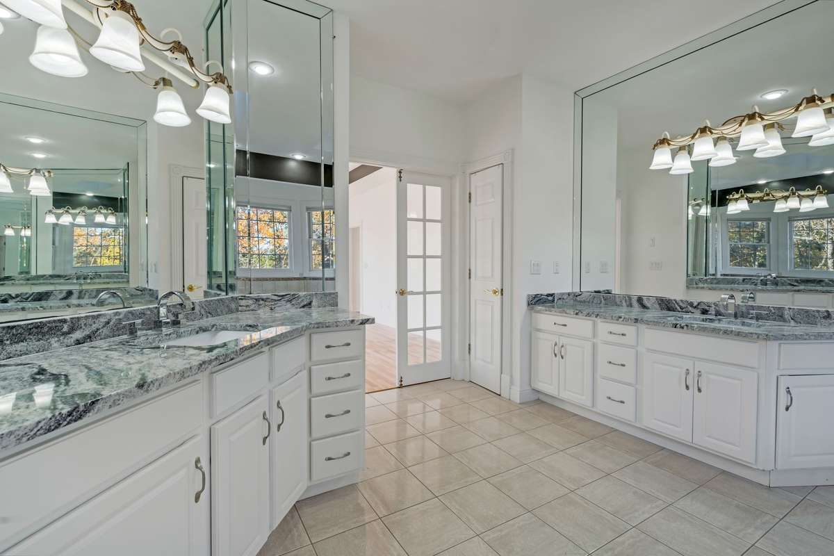 The primary bathroom has been renovated with high-end finishes top to bottom. You will enjoy and appreciate the large separate vanities.