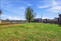 Level fully fenced backyard with endless possibilities