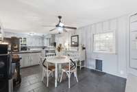 The kitchen has ample cabinetry and has custom built in shelving