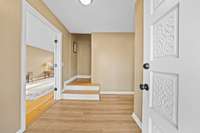 Front entrance has a double door enters into a foyer