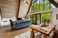 Dining area and living room with lots of natural light.