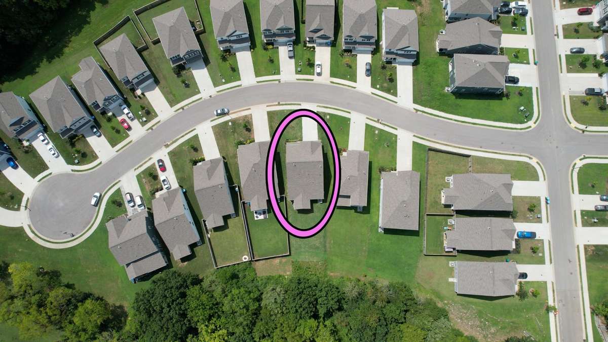 Enjoy one of the few large, flat, tree-lined lots in Portico. The side entrance to the commnunity is to the right of the home, giving you quick access into and out of the commnunity while still being on a quiet, cul de sac street.