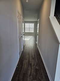 Front entry foyer into the unit with coat closet and half bath.