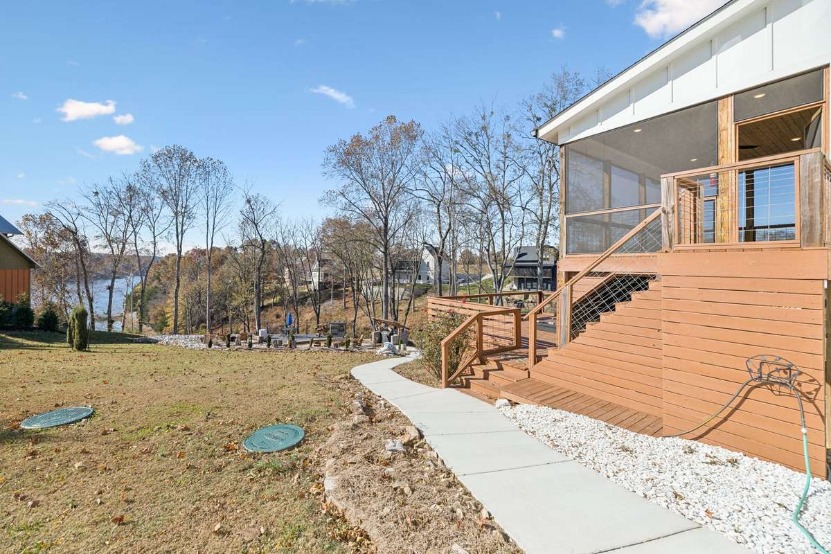The perfect setting for outdoor enjoyment, leading down to the firepit.