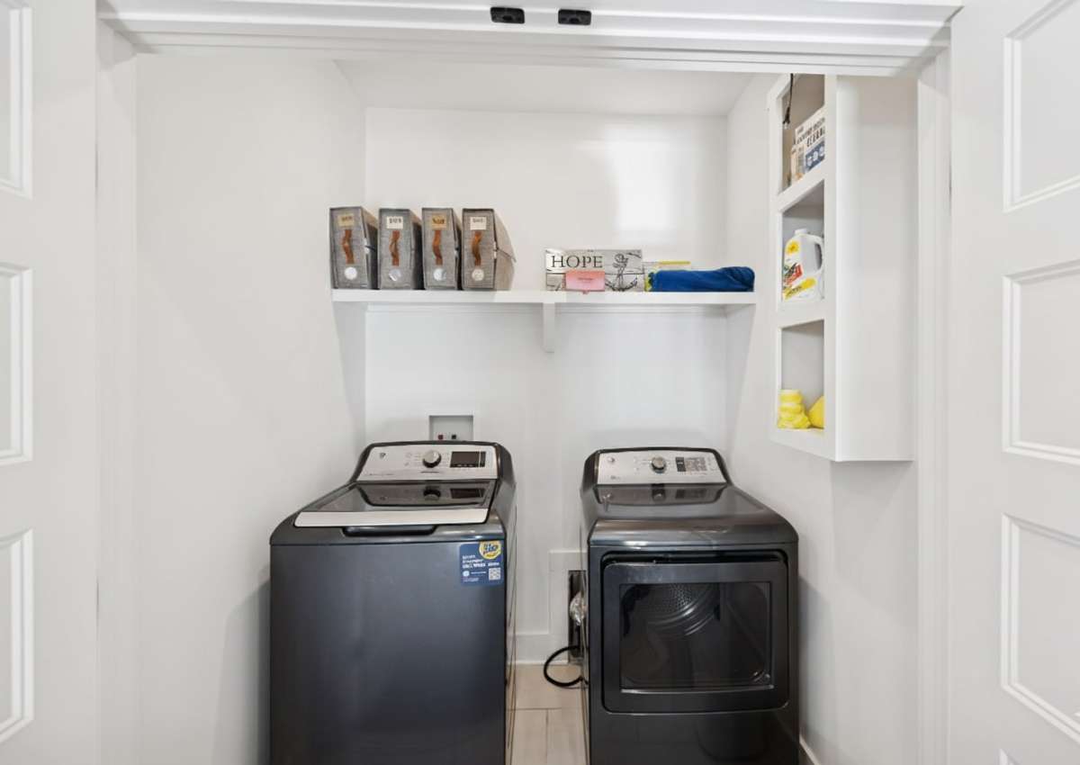 Convenient upstairs laundry area near the primary suite.