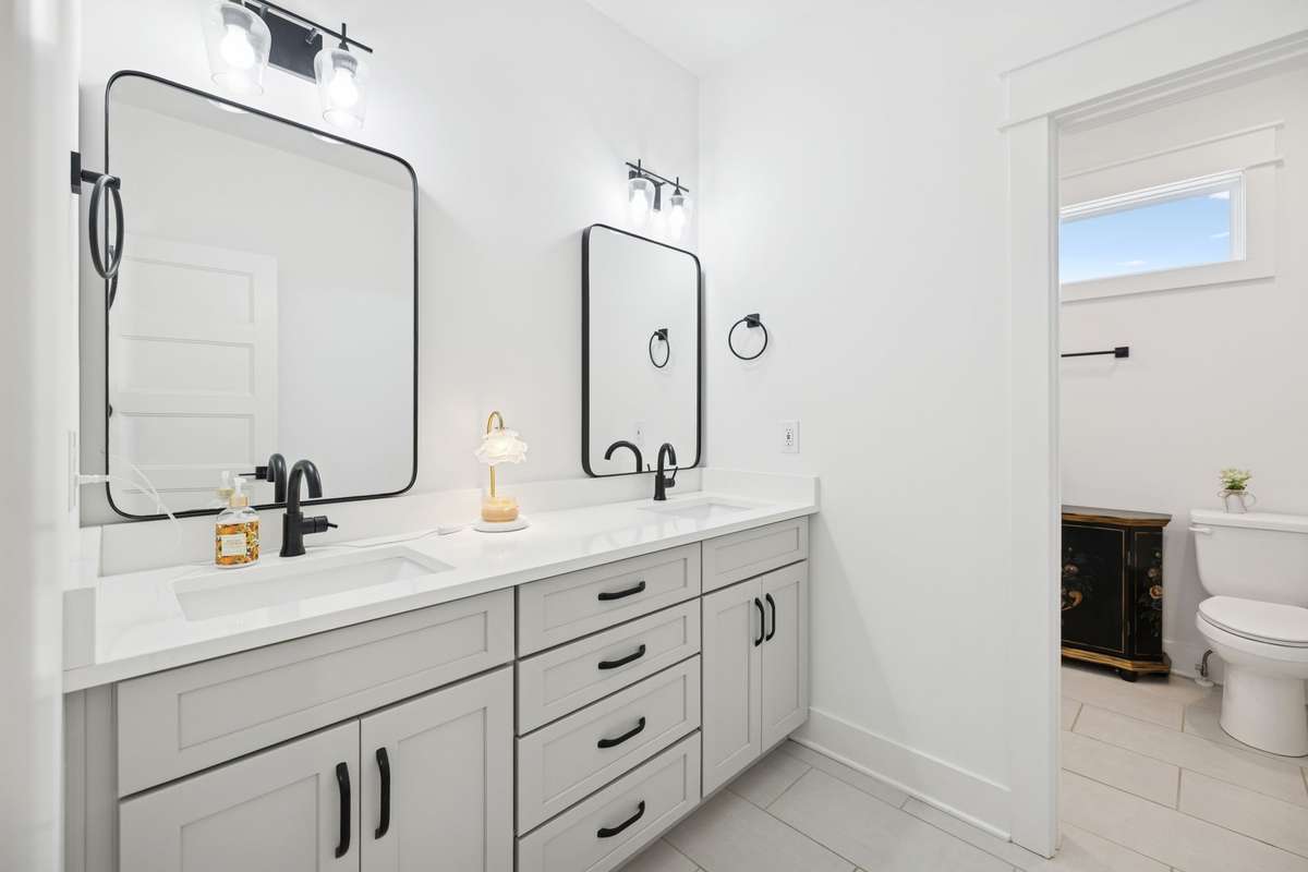 Stylish secondary bath with double vanity.