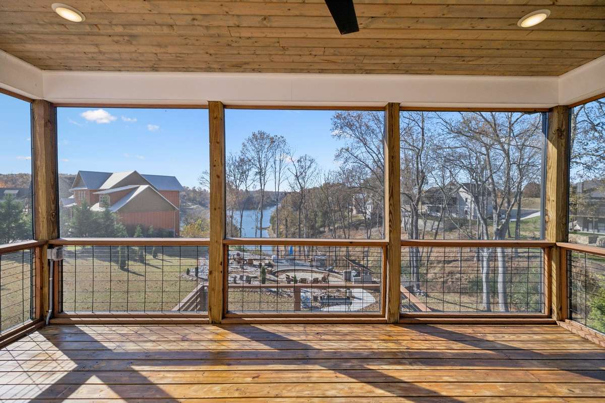 Relax and unwind on the spacious screened porch.