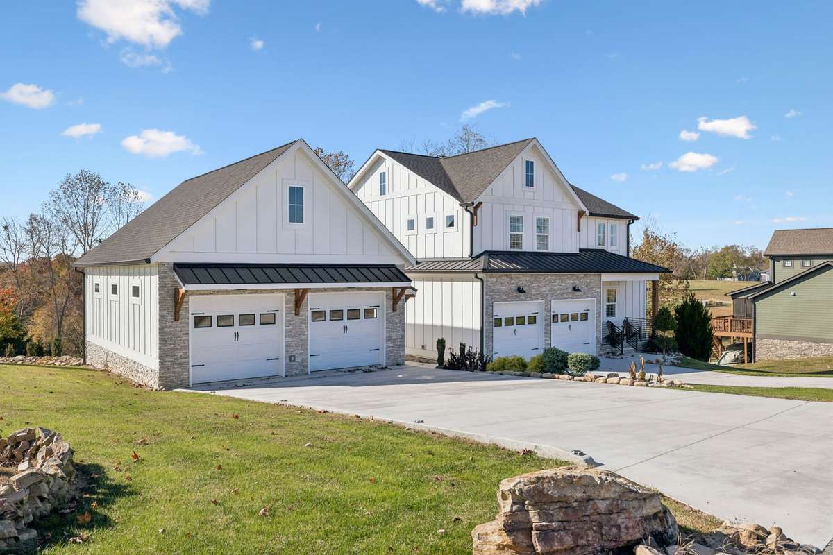 Front view with 26x34 oversized detached 2 car garage .