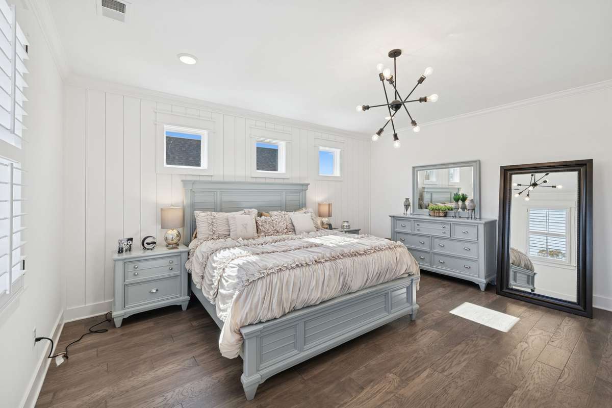 The perfect retreat Primary bedroom featuring shiplap accent wall.