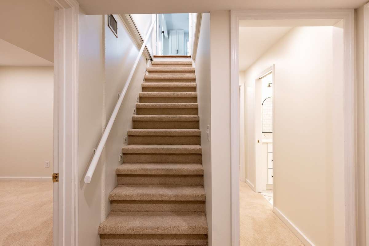 These stairs lead down to downstairs.