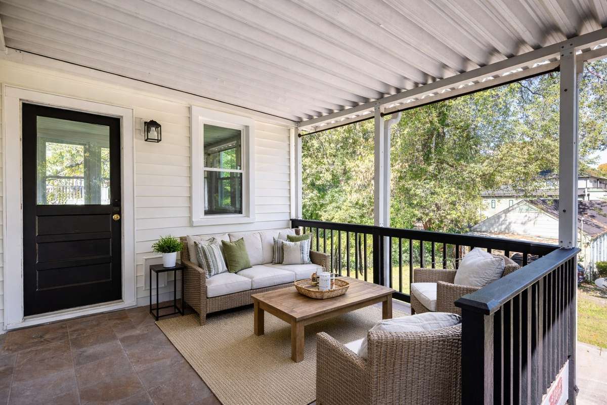 This covered porch area is a great place to add seating or a table for time outside and out of the rain and direct sun.