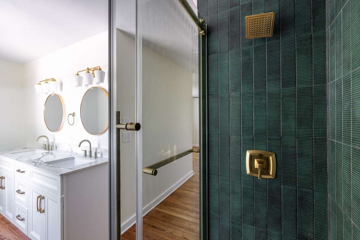 Entirely new bathroom with a custom double vanity, tile shower, and all new plumbing and electrical fixtures.