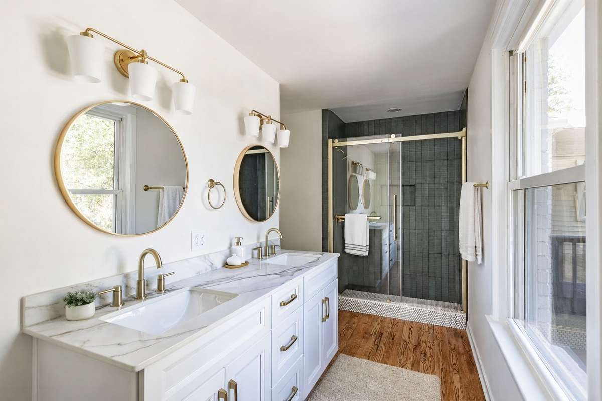 The moodiness of the dark green tile causes you to take a deep breath, while the large window and luxury porcelain countertops, gives and airy feel back into the room.
**Ai generated/Virtually staged photo**