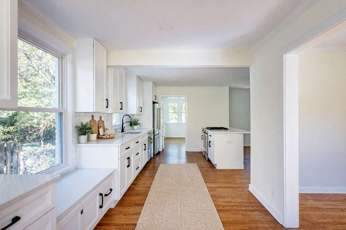 The beautifully refinished hardwood floors are original to the home and run continuously throughout the main level.
**Ai generated/Virtually staged photo**
