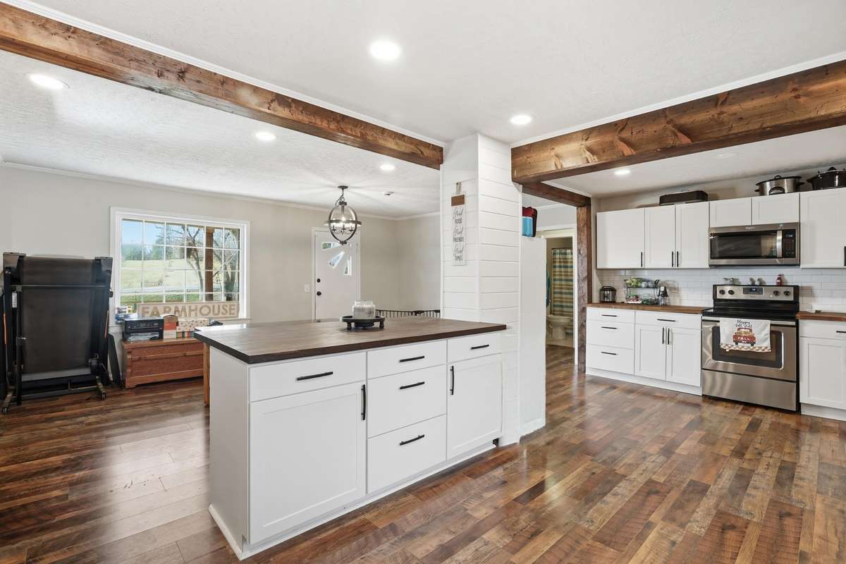 New cabinets, countertops, floors. Notice those beautiful beams too!