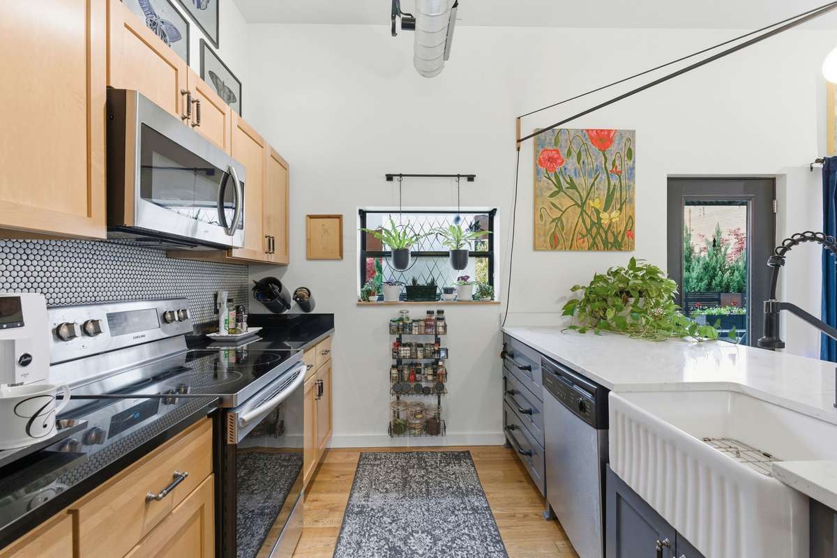 Farmhouse ceramic sink, stainless steel appliances + ample counter space