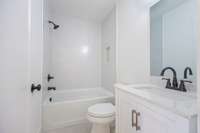 Full bath en-suite for the downstairs bedroom.