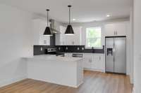 This stunning kitchen is the heart of the home, combining style and function with gorgeous finishes!