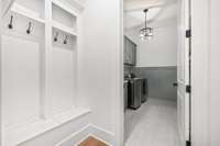 Spacious laundry room and drop zone with plenty of storage and room everyone’s things!