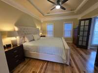 Master bedroom. Split-Bedroom design. Beautiful high ceilings with woodwork throughout.
