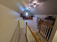 Bonus room above garage. 25x12 white cabinets/drawer shelfs do not remain.