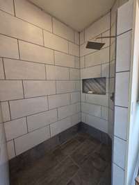 Curb-less walk-in shower. No shower curtain or glass required.