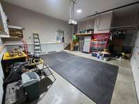 2 car garage. Refrigerator and upright freezer do NOT remain.