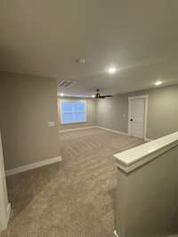 This bonus room has plenty of space and offers versatility for a homework area or work from home space as well!