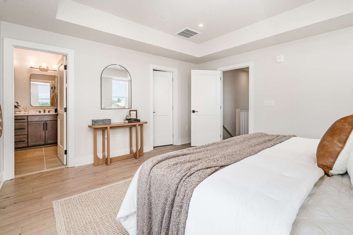 Primary bedroom *Photos and renderings are for representational purposes only are of a similar floor plan with differing finishes*