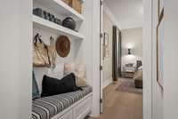 Located off of the garage is a drop zone bench and a Powder room. Photo is for informational purposes only.