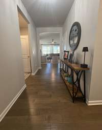 Inviting open-concept design flows from the front entry into the spacious living area — perfect for entertaining or everyday family living.