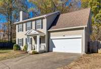 Three bedrooms, 2.5 baths, two car garage, one third acre lot.