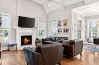 The cozy den, perfect for family nights or casual get-togethers while staying connected to the kitchen