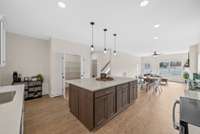 A huge island plus a large coffee bar area