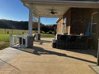 Bring your patio furniture and grill and enjoy this large patio area!  The bar and bar stools convey with the property