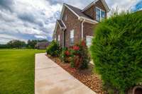 The landscaping and grounds on this home are very well maintained.