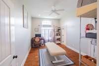 After leaving the office, our tour continues to the left to bedroom 1.  The room is currently being used as an office and has it's own full bath.