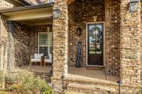 Great front porch for relaxing and decor.