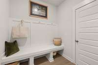 A drop zone right off the three car garage for all your muddy boots and backpacks!