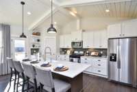 Imagine having friends or family over with this huge island!! Photo not of actual home.