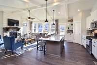 This space was made to entertain!! Everyone is included in this open kitchen and living room area.  Photo not of actual home.