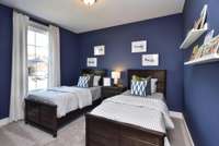 Second additional bedroom downstairs.  Photo not of actual home.