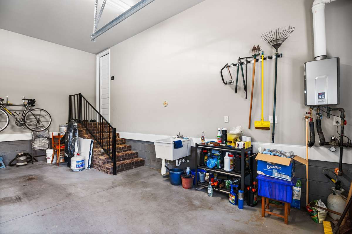 This garage is perfectly designed to function well. Tools and toys all have a place in this 24'X35' side entry on a corner lot... There is a utility sink for your clean up needs.