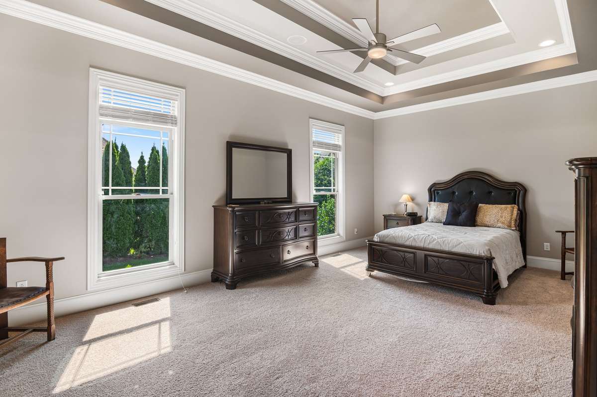 Owners Suite is accented with trayed ceiling is 14'X22'. Tremendous natural light. The entire home has custom blinds for the days you desire to sleep in.