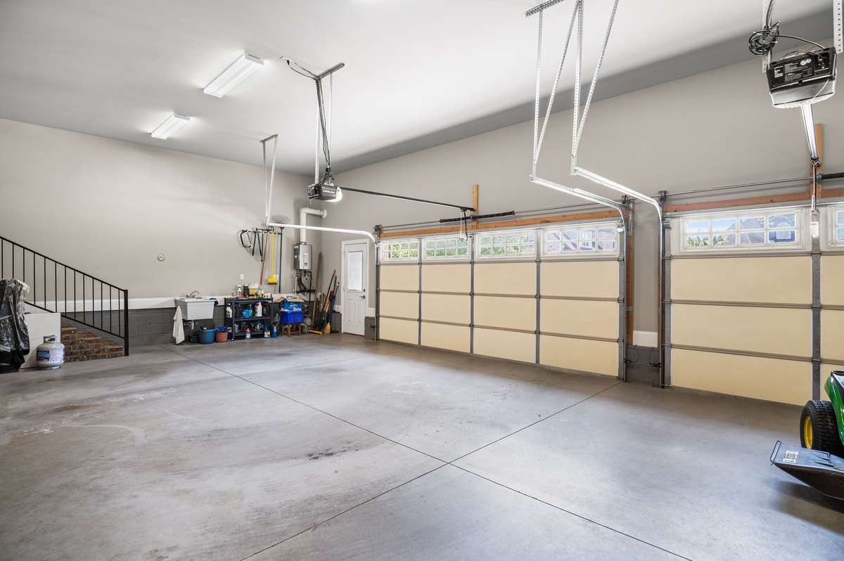 Insulated garage doors. The two and one combination provide space to open and close the car doors, the increased size provides space for equipment and toys.