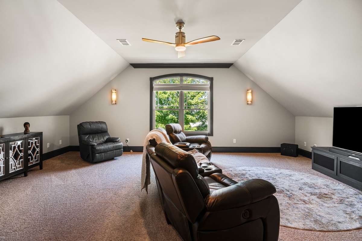 Every element within this spectacular media/game room has been meticulously curated for an unparalleled experience, including custom lighting sconces that flawlessly set the mood for every cinematic journey or competitive game night.
,