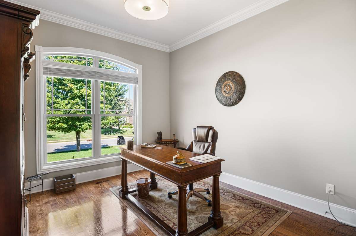 Left of entry foyer is bedroom being utilized as an office. The view is inspiring.