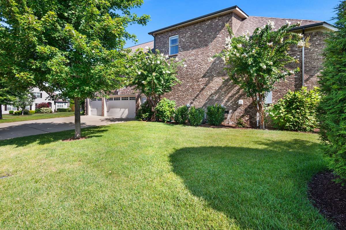 The landscaping was professionally designed to allow for a pop of color most of the year, along with privacy.