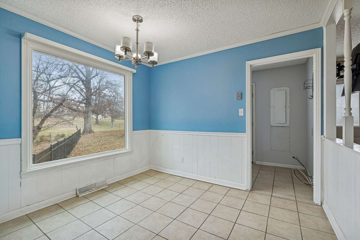 Dining area with large picture window and beautiful views of the neighboring horse farm.